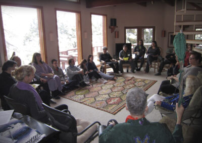 A retreat group’s circle in the second floor living room – framed by Wheeler Peak through the clerestory windows.