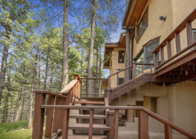 The finished north, outdoor heavy-beam staircase.